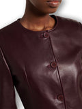 Burgundy genuine leather button-front jacket – round neck side view women's luxury coat
