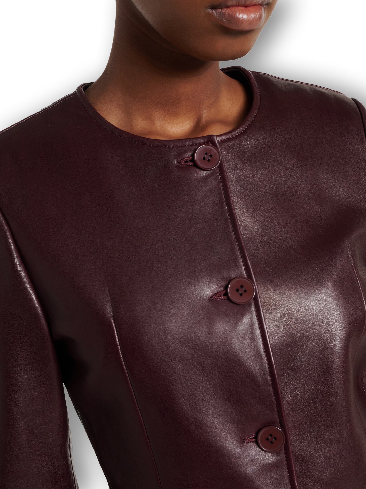 Burgundy genuine leather button-front jacket – round neck side view women's luxury coat
