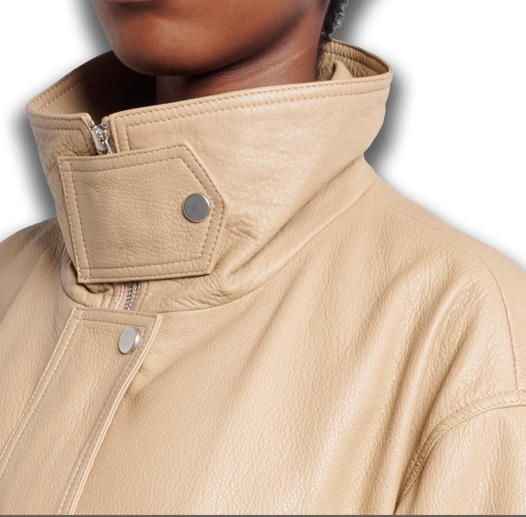 Camel leather bomber jacket collar and pocket detail – premium women's luxury outerwear